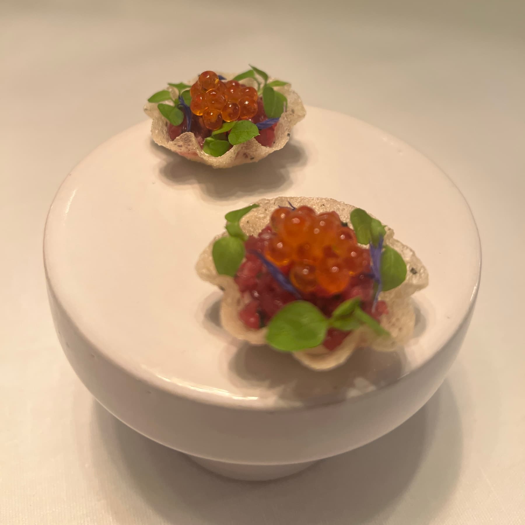 Tartare topped with salmon roe on crispy shells